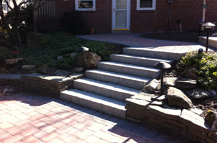 Stone stairs, patio, and sidewall installed by Diebolt Landscape in Wymossing Park PA